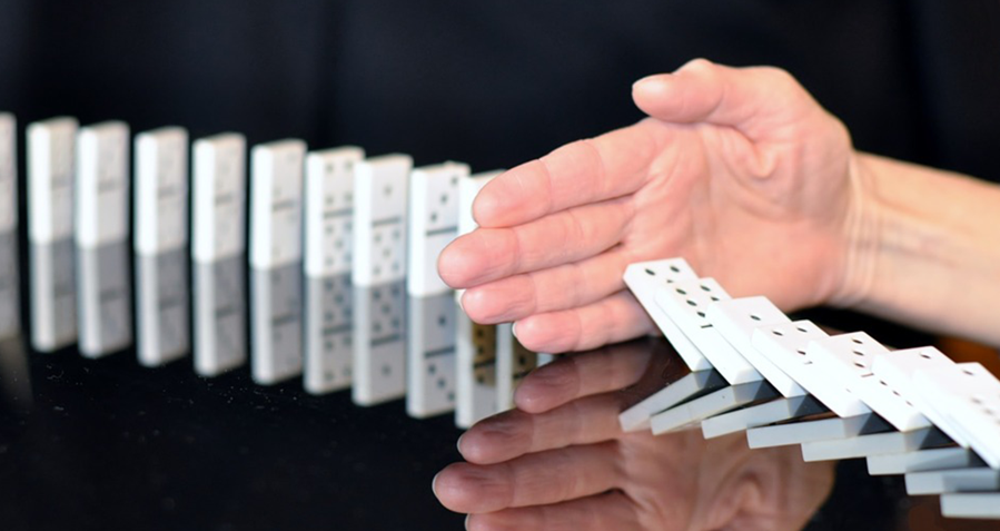 stopping dominoes from falling